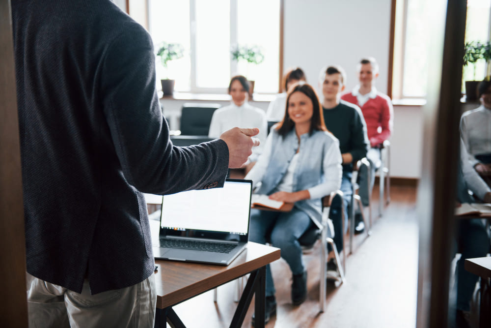 cheerful-mood-group-of-people-at-business-conference-in-modern-classroom-at-daytime (1)