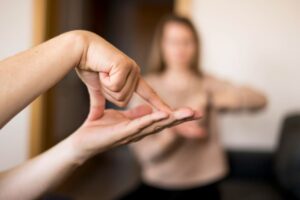 close-up-person-communicating-through-sign-language (1)