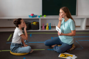 psychologist-helping-girl-in-speech-therapy (1)