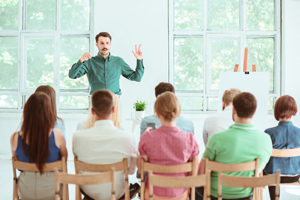 speaker-at-business-meeting-in-the-conference-hall (1)