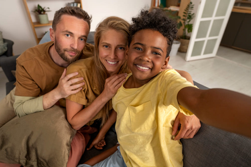 high-angle-smiley-parents-and-kid (1)